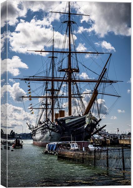 HMS WARRIOR in PORTSMOUTH HARBOUR  Canvas Print by DAVE BRENCHLEY