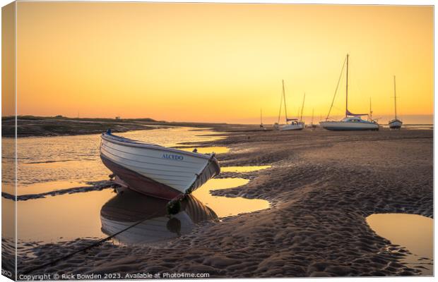 A Glowing Sunrise on the Brancaster Staithe Canvas Print by Rick Bowden