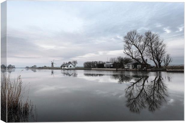 Reflections of Trees At Thurne Canvas Print by Rick Bowden