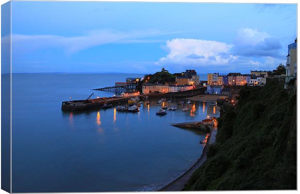 Sunset Tenby Harbour with lights Canvas Print by Jonathan Evans