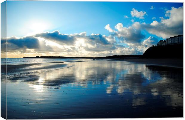 Tenby beach in winter blue reflection Canvas Print by Jonathan Evans