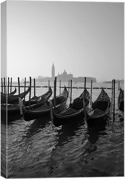 Venice and Gondolas with church in background  Canvas Print by Jonathan Evans