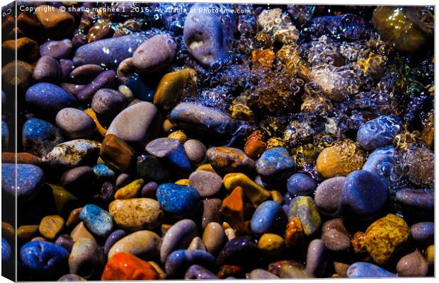  Waves over Multi color rocks Canvas Print by shawn mcphee I