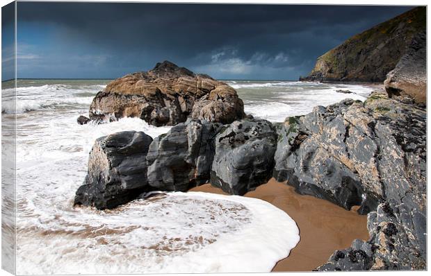  Incoming tide on Penbryn beach, West Wales. Canvas Print by Andrew Kearton