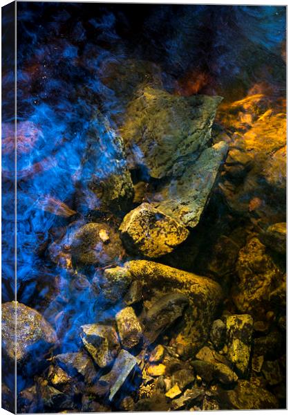 Rocks below the water of a moorland stream Canvas Print by Andrew Kearton