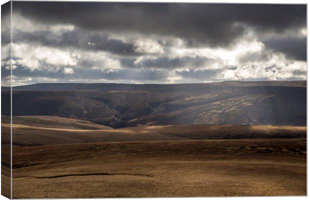 Sunbeams over the moors Canvas Print by Andrew Kearton