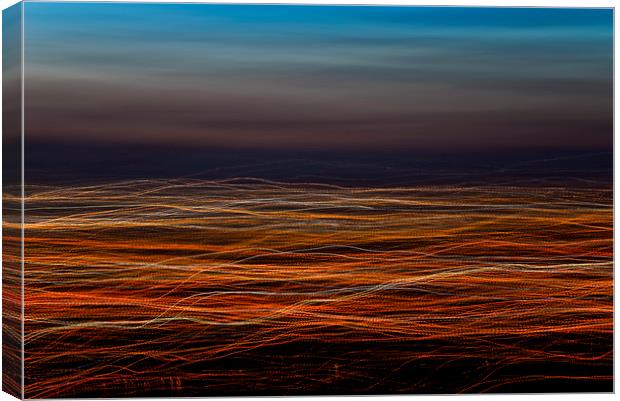 Trails of light at dusk Canvas Print by Andrew Kearton