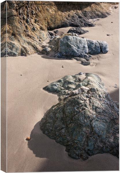 Soft sand and textured rocks Canvas Print by Andrew Kearton