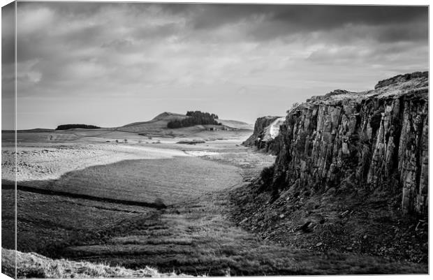 Crag Lough on the Roman wall Canvas Print by John Malley