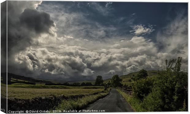 Storm clouds gathering over Muker Canvas Print by David Oxtaby  ARPS