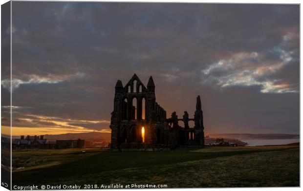 Sun setting over Whitby Abbey Canvas Print by David Oxtaby  ARPS