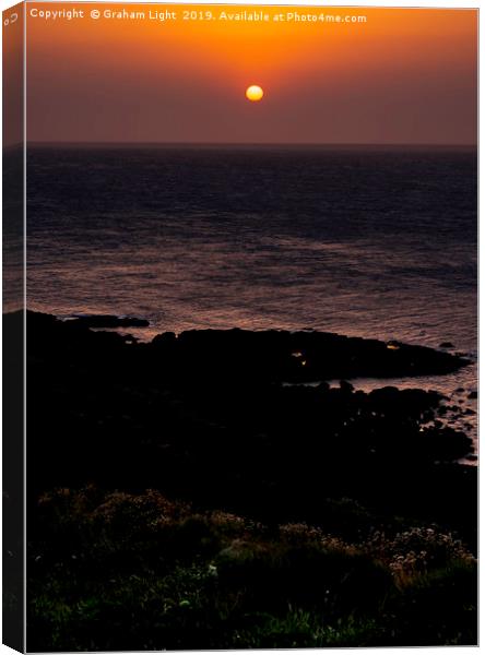 Setting sun over Cape Cornwall Canvas Print by Graham Light
