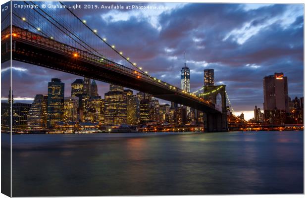 Manhattan and Brooklyn Bridge at night Canvas Print by Graham Light