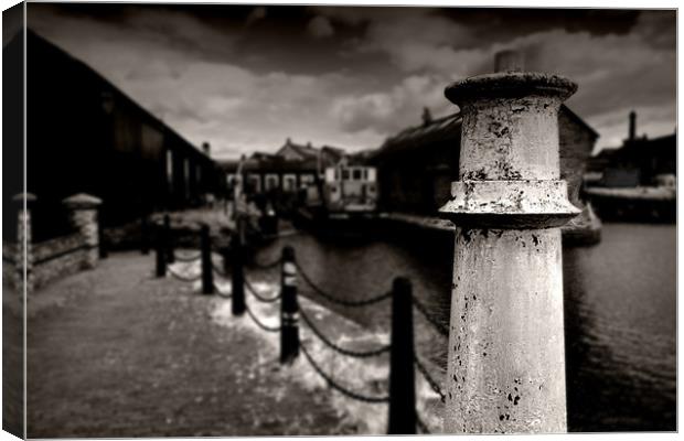 Decaying Harbour Canvas Print by Reg Atkinson