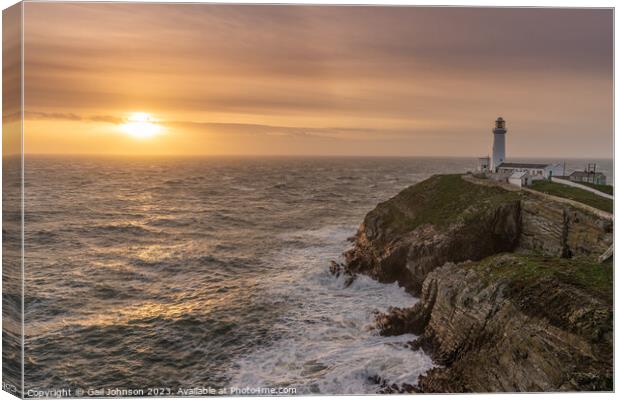 Rough weather off the lighthouse at sunset Isle of Anglesey Nort Canvas Print by Gail Johnson
