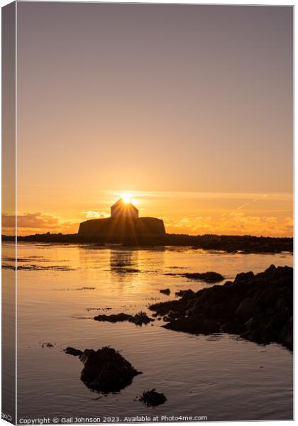 Sunset at the church on the island - St Cwyfan's Anglesey  Canvas Print by Gail Johnson