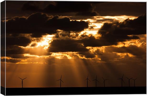 Sunbeams over a wind farm Canvas Print by Gail Johnson