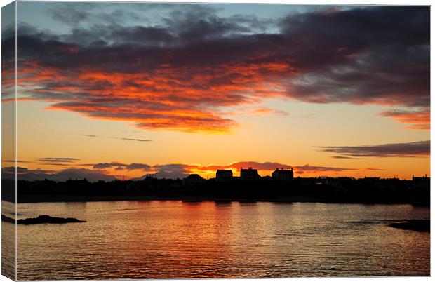 Trearddur bay Sunrise with the sun rising over Sno Canvas Print by Gail Johnson