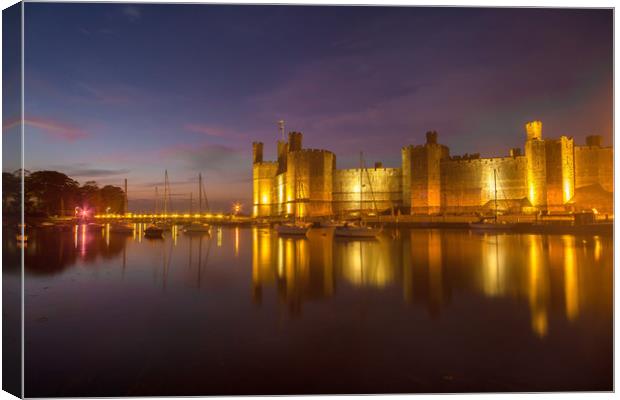 Caernarfon Castle at dusk with yachts floating at  Canvas Print by Gail Johnson