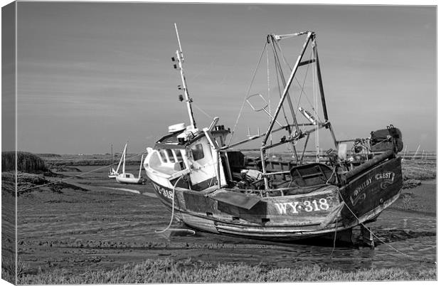 Monochrome of Whitby Crest at Brancaster Staithe Canvas Print by John Edwards