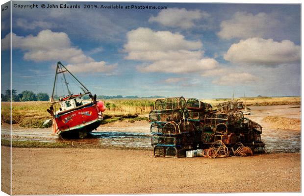 Whitby Crest and Lobster Pots Canvas Print by John Edwards