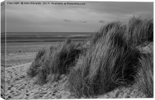 Marram Grass on The Wash Canvas Print by John Edwards