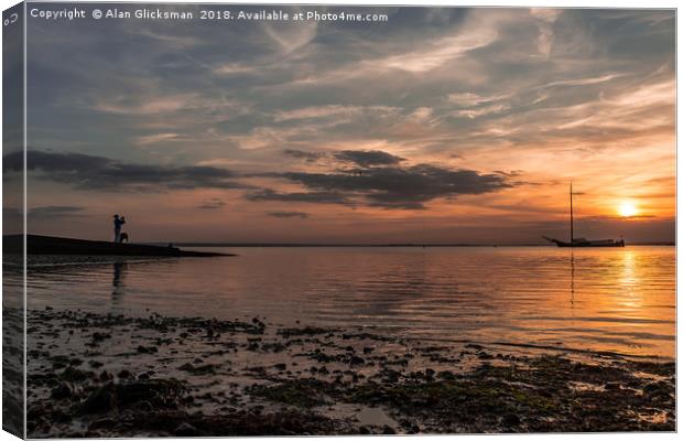 Sun sea and silhouette Canvas Print by Alan Glicksman