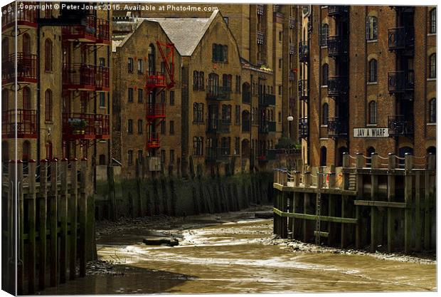  Low tide at Java Wharf. Canvas Print by Peter Jones