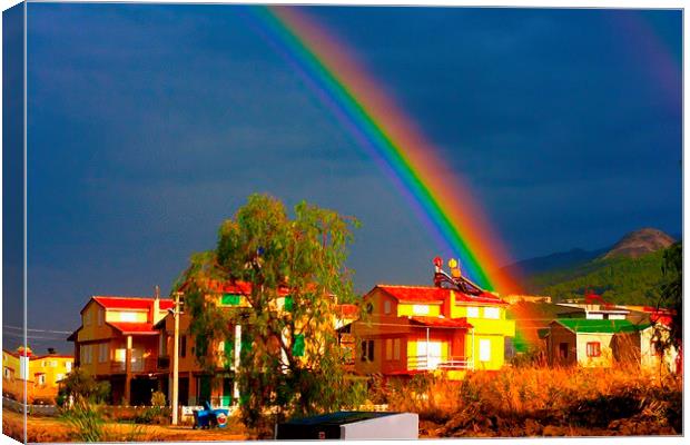 A digital painting of a rainbow over villas in the Canvas Print by ken biggs