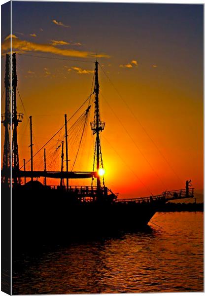 a ship in silhouette at sunset  Canvas Print by ken biggs