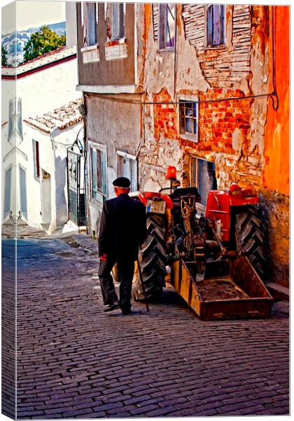 an elderly man walking past a tractor in a Turkish Canvas Print by ken biggs