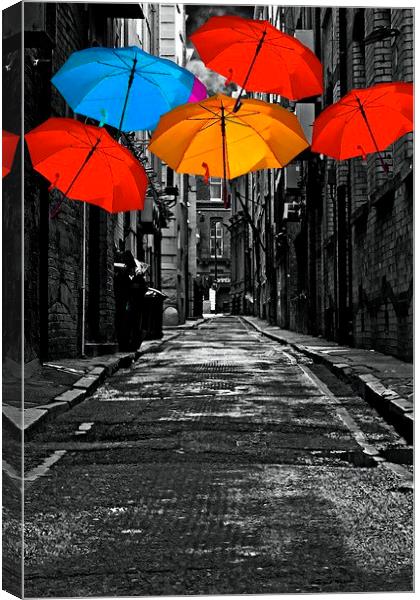 colorful umbrellas in a dark back street alley Canvas Print by ken biggs