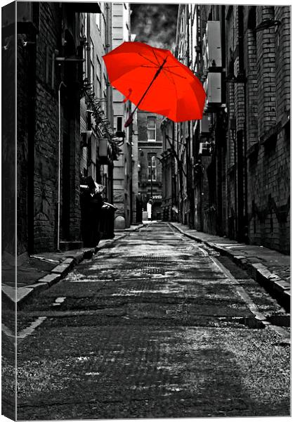 colorful iumbrella in a dark back street alley Canvas Print by ken biggs