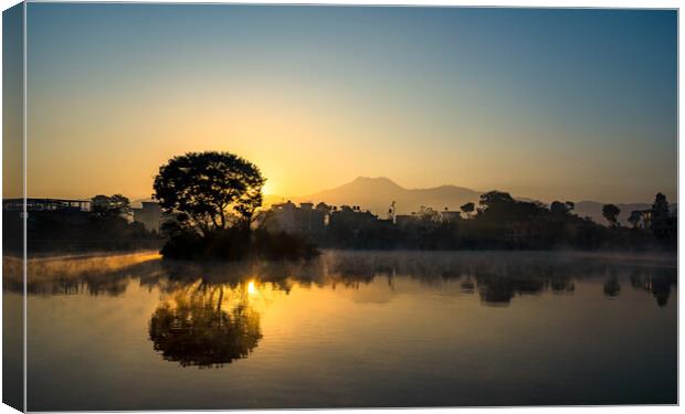 Landscape view of Sunrise over the Taudah lake Canvas Print by Ambir Tolang