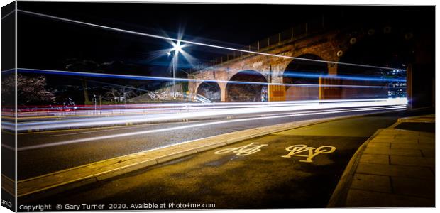 Arches Light Trails Canvas Print by Gary Turner