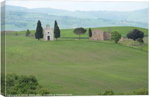 Hillside Farm and church in Tuscany Canvas Print by Adrian Beese