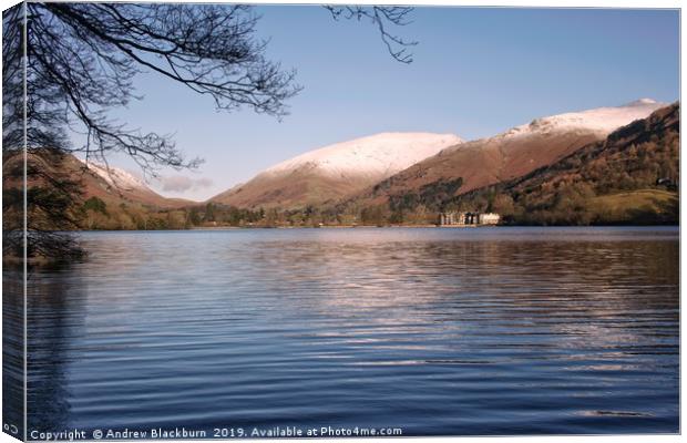 Grasmere with snow capped fells in the background. Canvas Print by Andy Blackburn