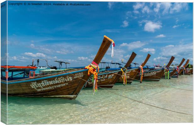 Longtail boats at Bamboo island, Thailand Canvas Print by Jo Sowden