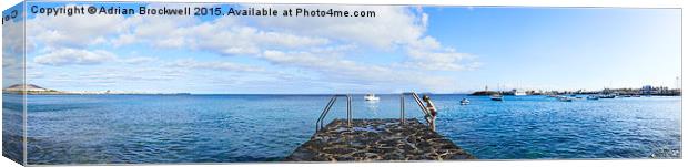 Steps to sea in Playa Blanca Panarama Canvas Print by Adrian Brockwell