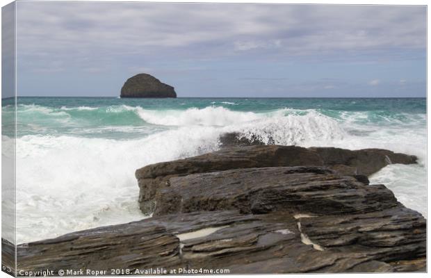 Waves crashing over rocks with Gull rock in the di Canvas Print by Mark Roper