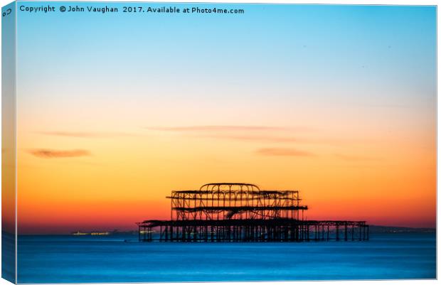 Sunset over West Pier Canvas Print by John Vaughan