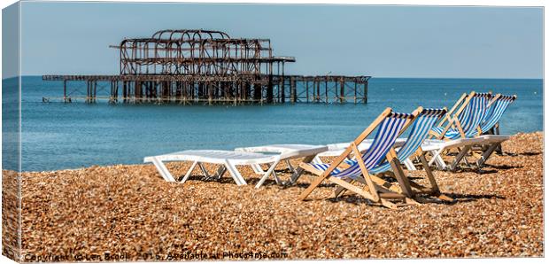 Brighton Beach West Pier Deckchairs. Canvas Print by Len Brook