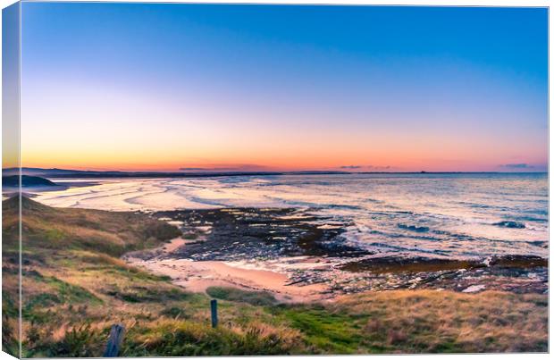 Sunset over beautiful Bamburgh Canvas Print by Naylor's Photography
