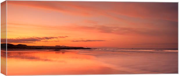  Red sunset -Bamburgh beach Canvas Print by Naylor's Photography