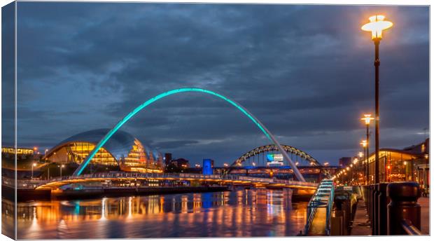 Beautiful bridges and quayside at night Canvas Print by Naylor's Photography