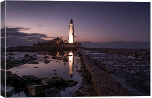  Lighthouse at Night Canvas Print by Les Hopkinson