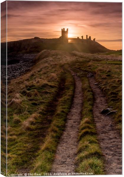 Dunstanburgh Castle at sunrise Canvas Print by Phil Reay