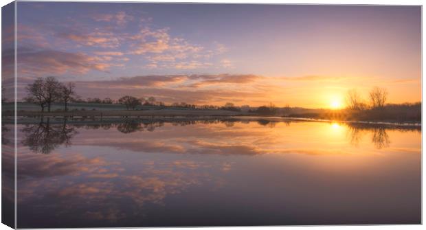 Sunrise over Mill pond Canvas Print by John Allsop