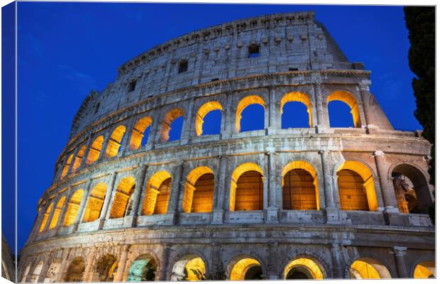 The Colosseum At Night In Rome, Italy Canvas Print by Artur Bogacki