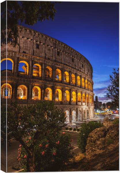 Nightfall At The Colosseum In Rome Canvas Print by Artur Bogacki